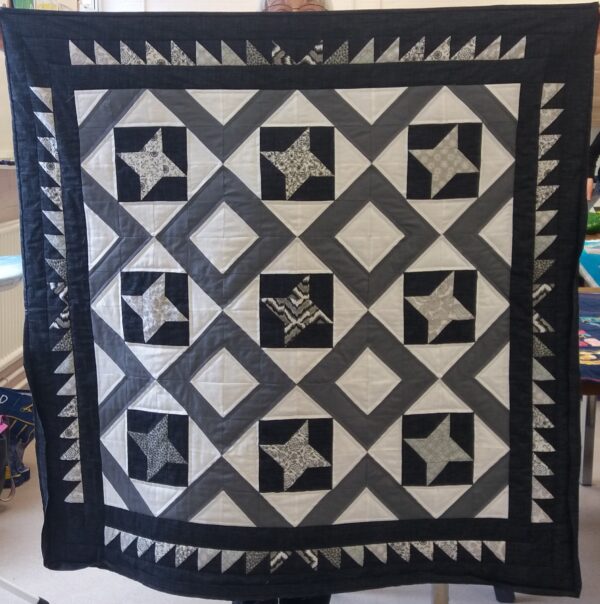 Black and White quilt using Friendship Star blocks
