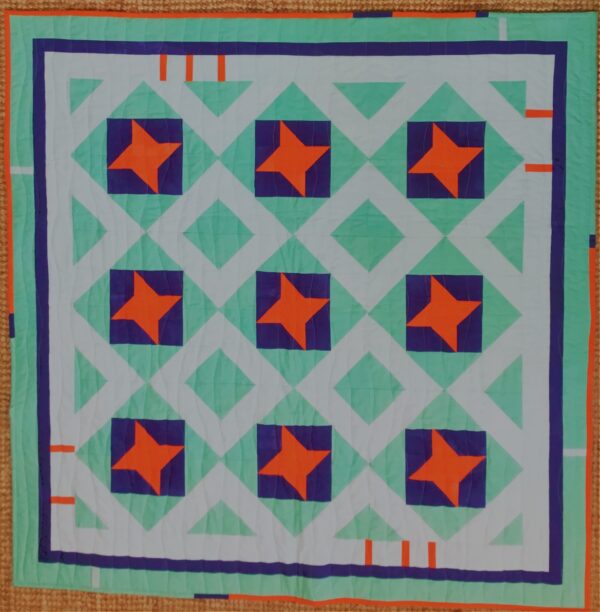 Turquoise, navy and orange Friendship Star quilt