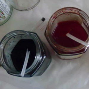 Indigo and Magenta Dye solutions in jam jars with teaspoons