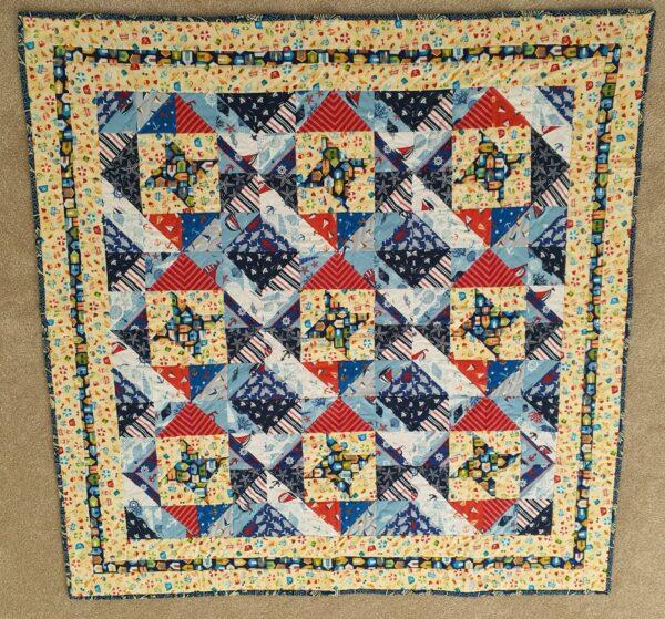 Beach themed Friendship Star quilt in red, blue and yellow
