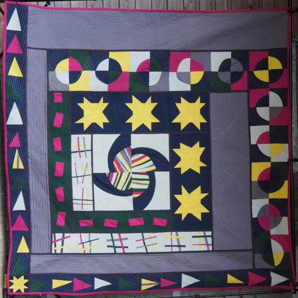 multi coloured quilt with lots of different walking foot quilting